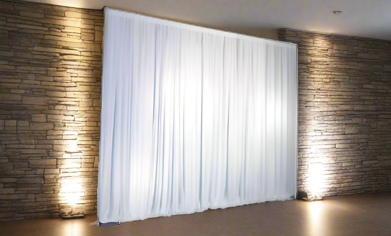 White curtain backdrop on a stand against a white background